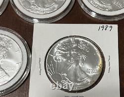 Lot Of 10 Silver Eagles 1oz Coin (5) 2005, (2) 1987, 1989, 1990 1986 With Toning