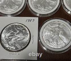 Lot Of 10 Silver Eagles 1oz Coin (5) 2005, (2) 1987, 1989, 1990 1986 With Toning
